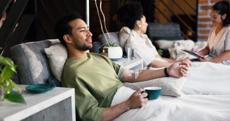 Man receiving an IV vitamin drip for wellness and hydration in Los Angeles