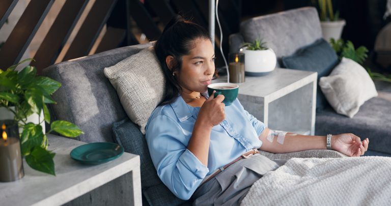 Patient relaxing during an at-home migraine IV drip in Los Angeles