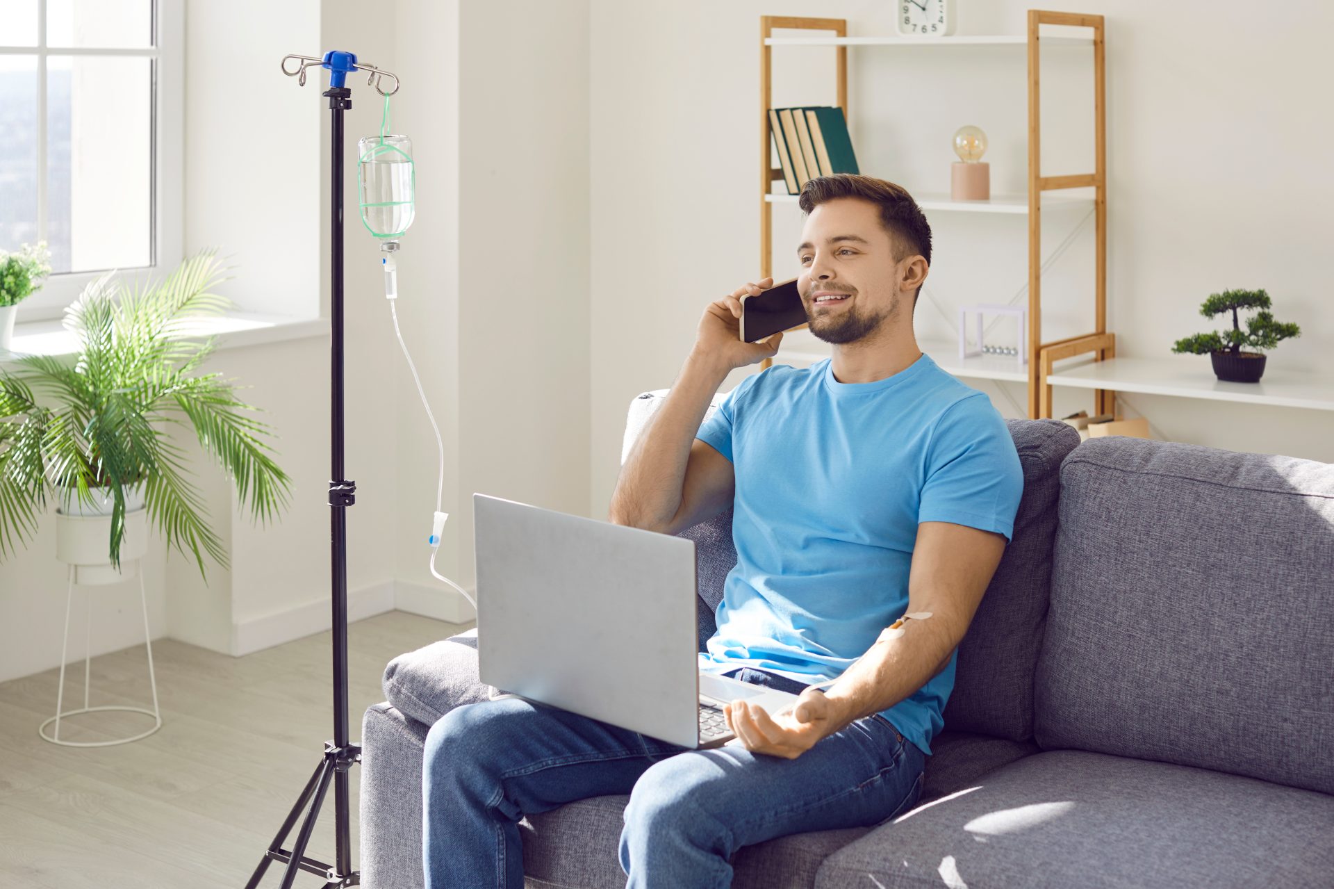 Man receiving an energy IV drip at home in Los Angeles
