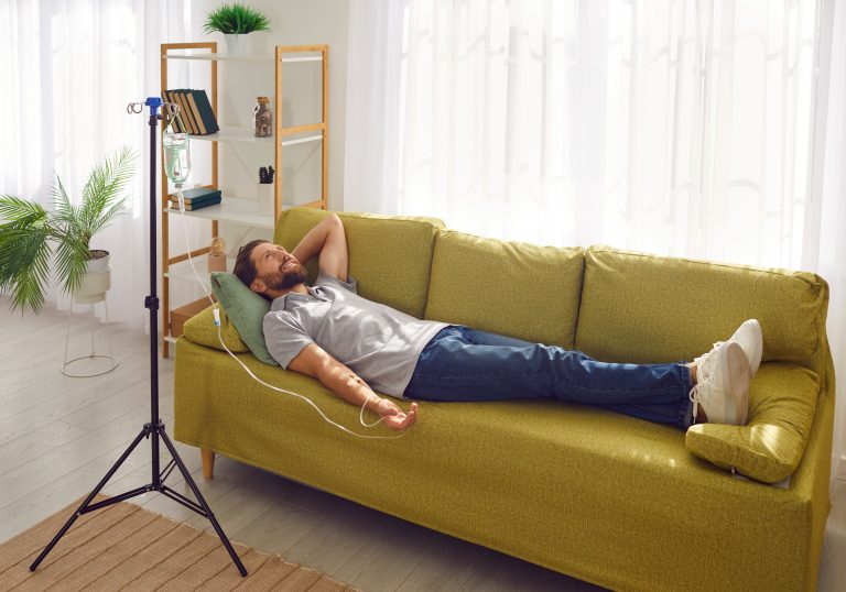 Man recovering at home with a mobile IV hydration drip in Los Angeles